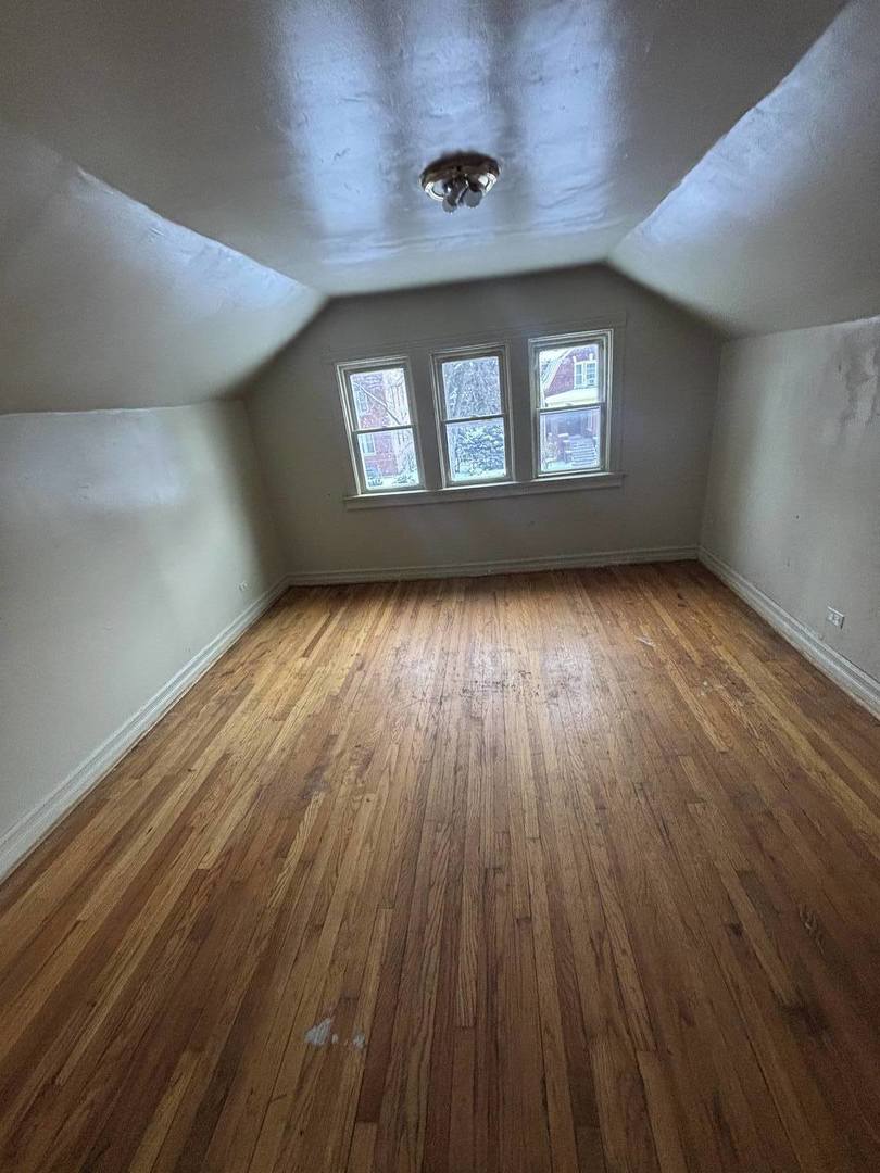 7007 South Ada Street Chicago, IL 60636 - Photo 48 of 49 wooden floor in an empty room with a window