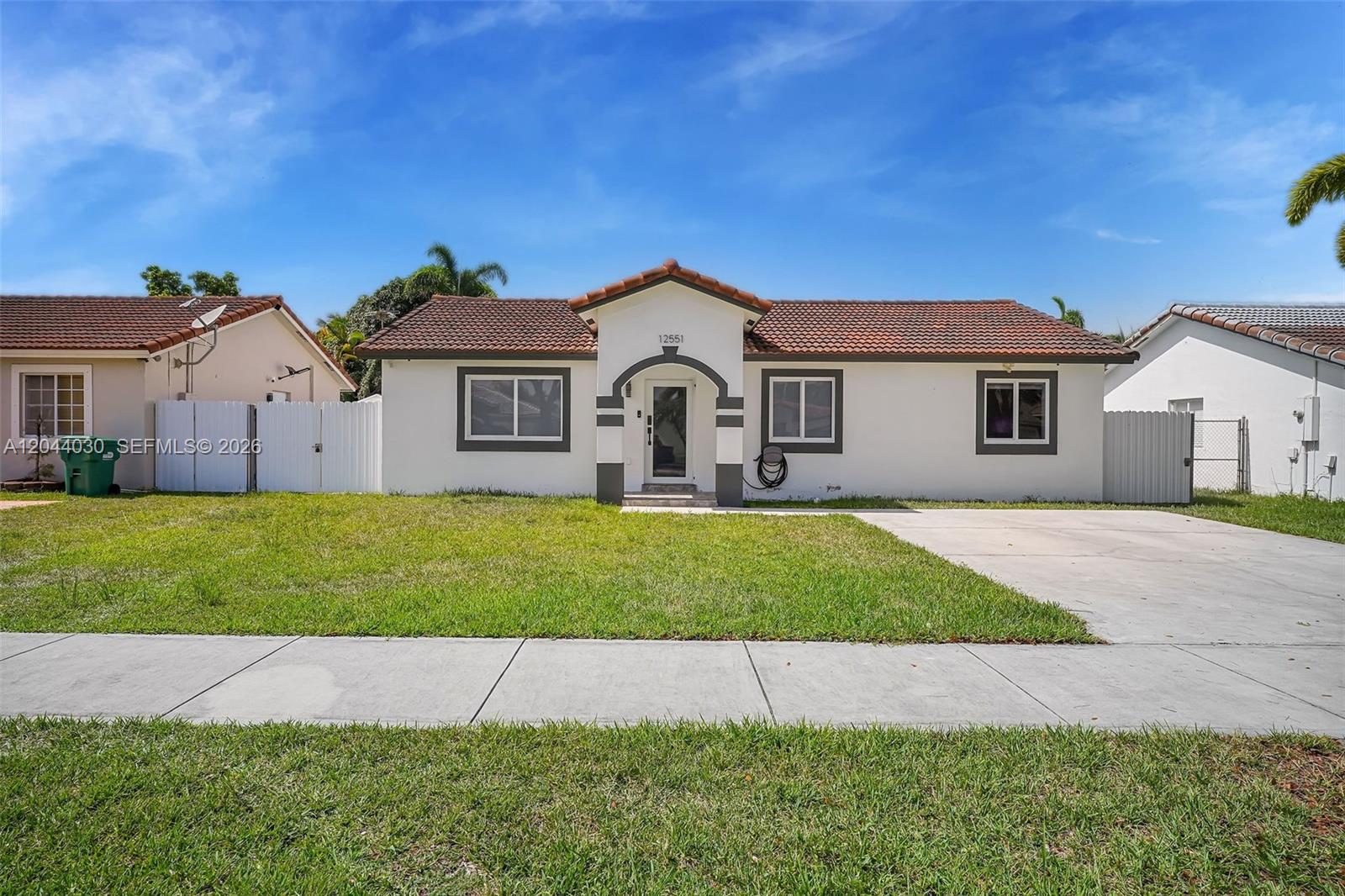 12551 Southwest 223rd Street Miami, FL 33170 - Photo 27 of 35 a house view with a garden space