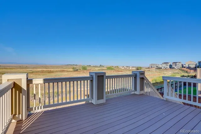 a view of a balcony with wooden floor