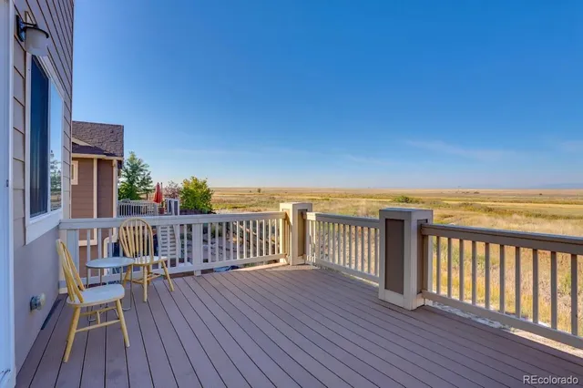 a view of balcony with wooden floor