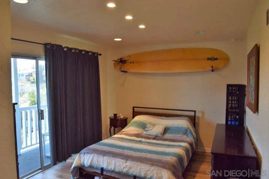 3159-3161 Cedar Street San Diego, CA 92102 - Photo 12 of 39 a bedroom with a bed and a walk in closet