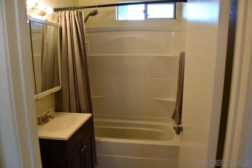 3159-3161 Cedar Street San Diego, CA 92102 - Photo 15 of 39 a bathroom with a sink and a shower