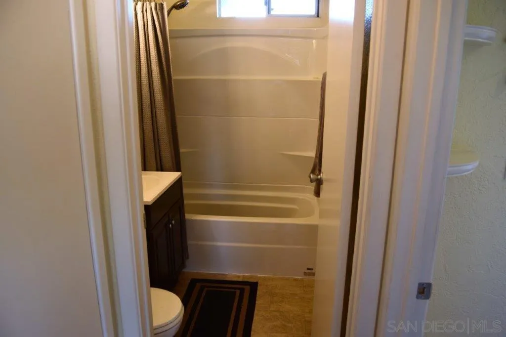 3159-3161 Cedar Street San Diego, CA 92102 - Photo 16 of 39 a bathroom with a toilet and a shower