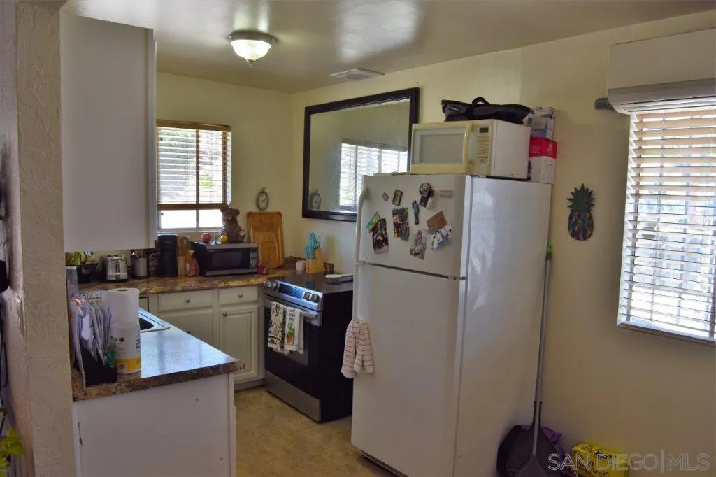 3159-3161 Cedar Street San Diego, CA 92102 - Photo 28 of 39 a utility room with closet dryer and washer