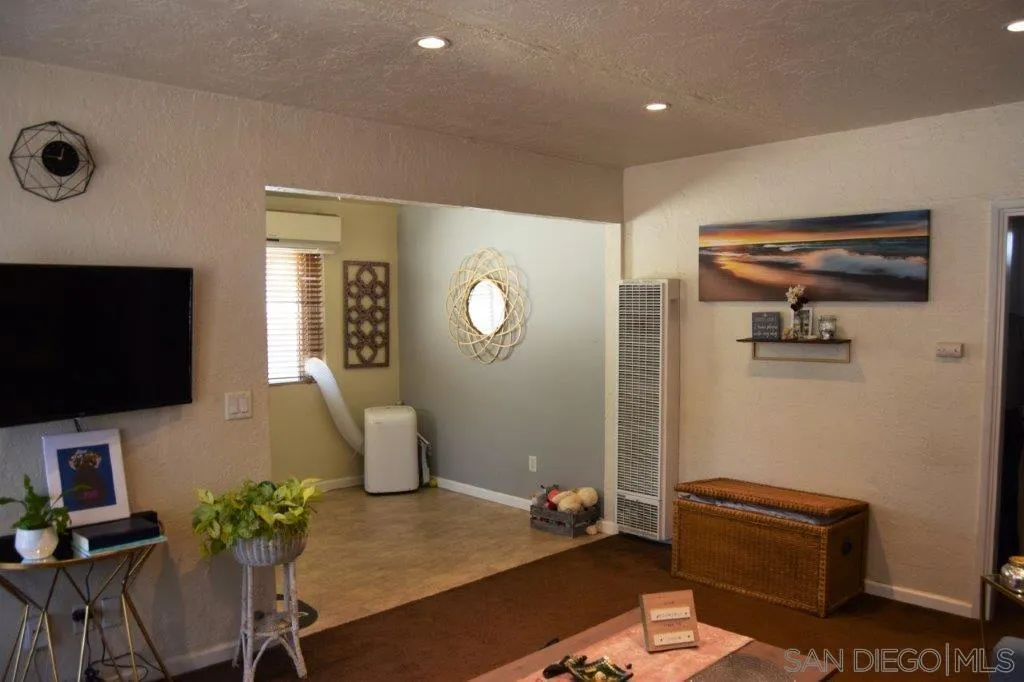 3159-3161 Cedar Street San Diego, CA 92102 - Photo 31 of 39 a living room with furniture and a flat screen tv