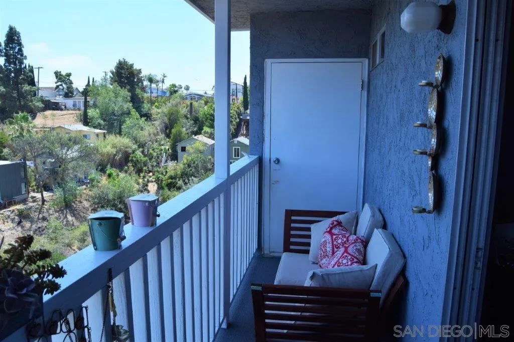 3159-3161 Cedar Street San Diego, CA 92102 - Photo 35 of 39 a view of a deck with wooden floor and outdoor seating