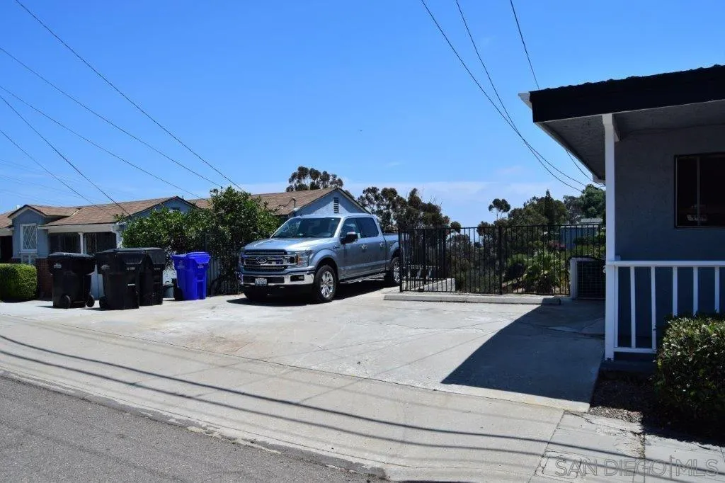 3159-3161 Cedar Street San Diego, CA 92102 - Photo 39 of 39 a view of a house with car parked on the road