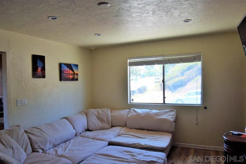 3159-3161 Cedar Street San Diego, CA 92102 - Photo 5 of 39 a living room with furniture and a window