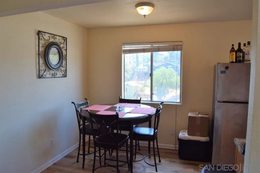 3159-3161 Cedar Street San Diego, CA 92102 - Photo 10 of 39 a dining room with furniture and window