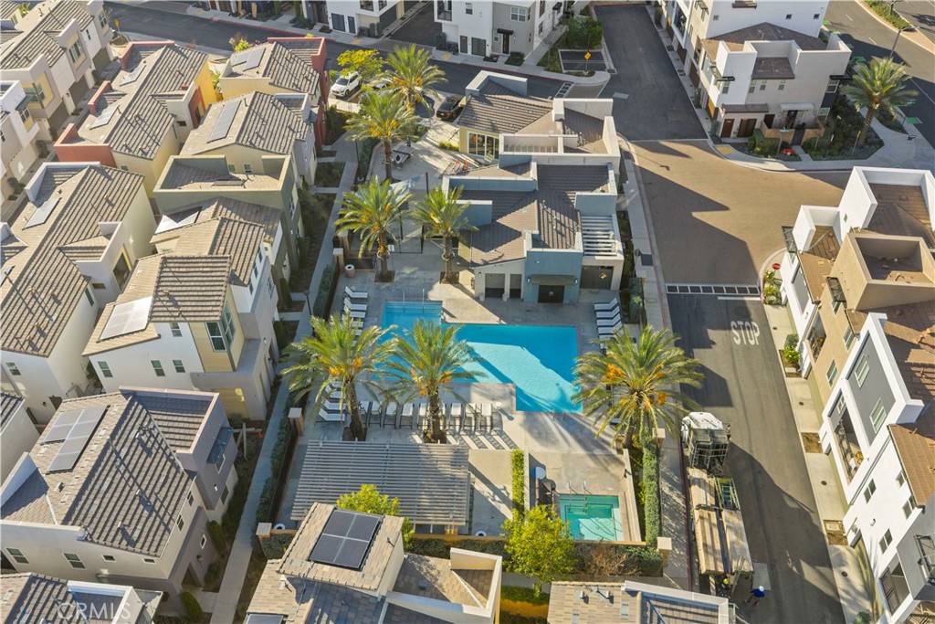 7803 Paxton Place Rancho Cucamonga, CA 91730 - Photo 13 of 44 an aerial view of a residential apartment building with a yard and balcony