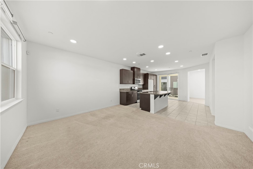 7803 Paxton Place Rancho Cucamonga, CA 91730 - Photo 17 of 44 a view of a kitchen with a sink and a microwave