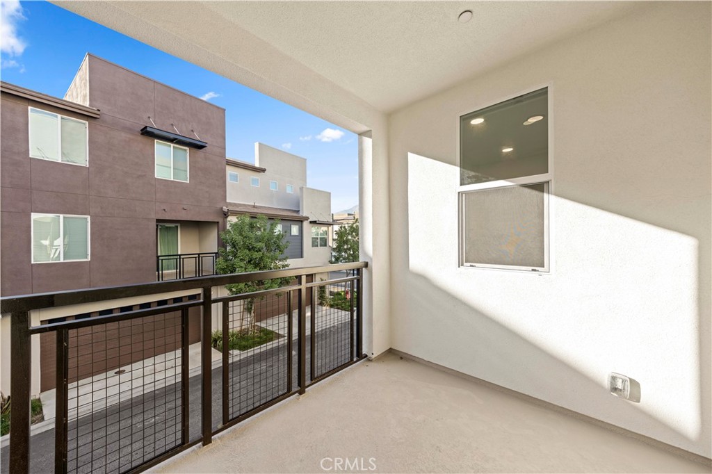 7803 Paxton Place Rancho Cucamonga, CA 91730 - Photo 23 of 44 a view of a house with a balcony
