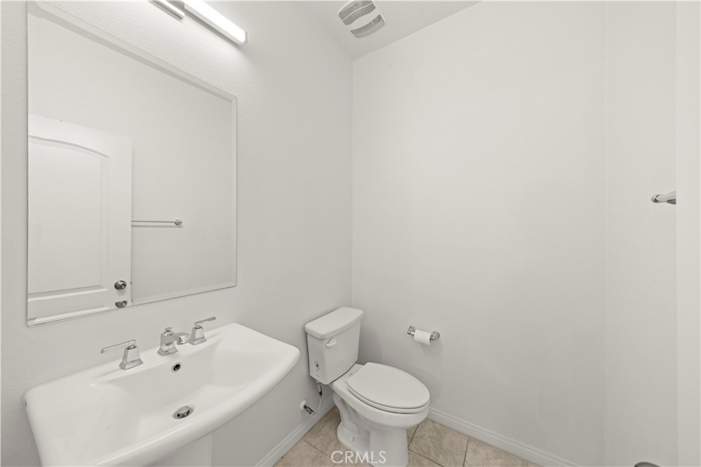 7803 Paxton Place Rancho Cucamonga, CA 91730 - Photo 24 of 44 a bathroom with a sink and a toilet