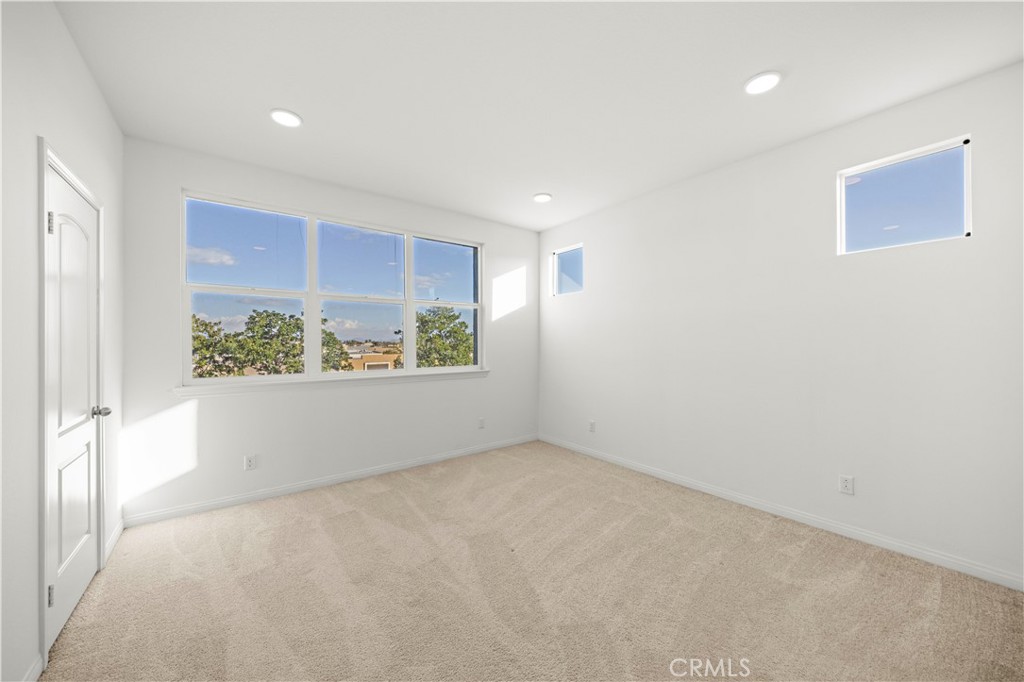 7803 Paxton Place Rancho Cucamonga, CA 91730 - Photo 25 of 44 a view of an empty room with a window