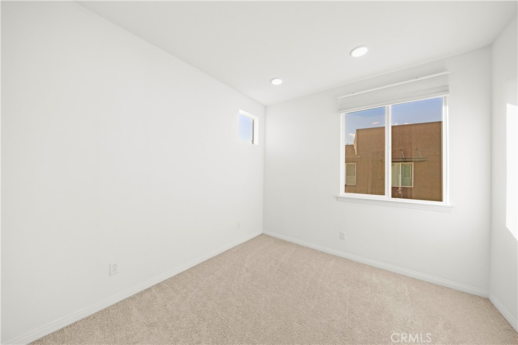 7803 Paxton Place Rancho Cucamonga, CA 91730 - Photo 30 of 44 an empty room with a window