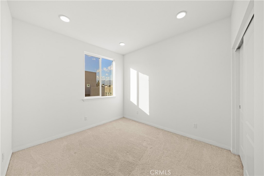 7803 Paxton Place Rancho Cucamonga, CA 91730 - Photo 34 of 44 a view of an empty room with a window