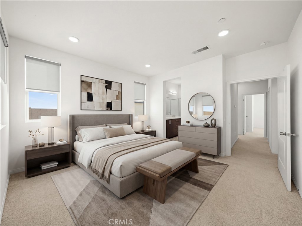 7803 Paxton Place Rancho Cucamonga, CA 91730 - Photo 4 of 44 a bedroom with a large bed and a chandelier