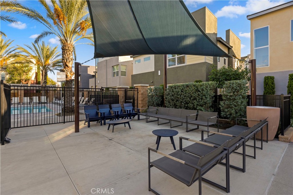 7803 Paxton Place Rancho Cucamonga, CA 91730 - Photo 42 of 44 a view of a patio with a table and chairs under an umbrella