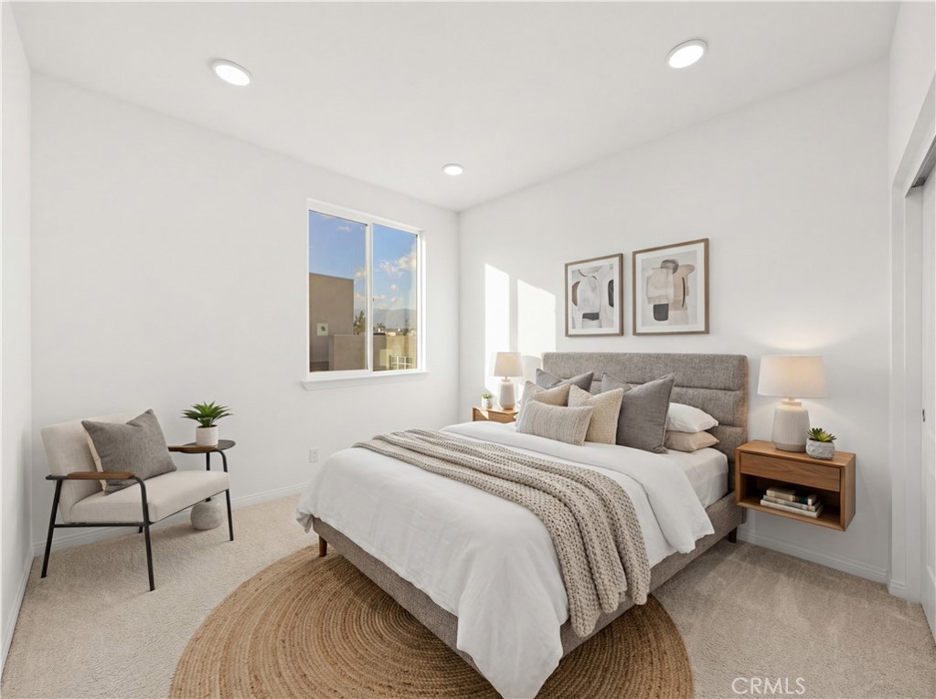 7803 Paxton Place Rancho Cucamonga, CA 91730 - Photo 6 of 44 a bedroom with a bed and a chair