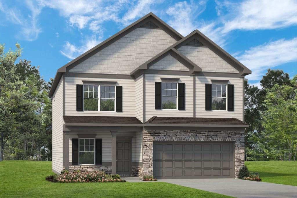 a front view of a house with garden