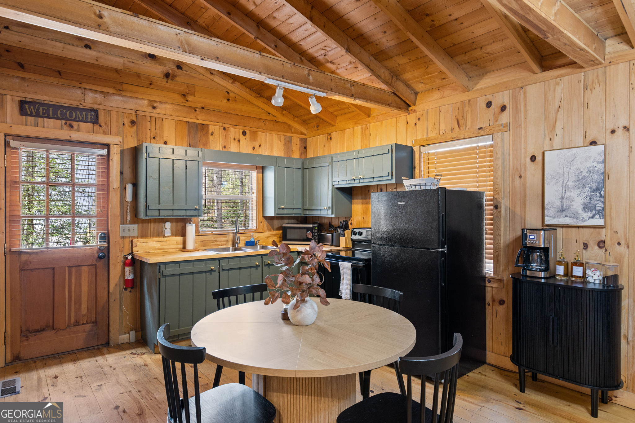 222 Icy Lane Blue Ridge, GA 30513 - Photo 11 of 37 a kitchen with refrigerator and chairs