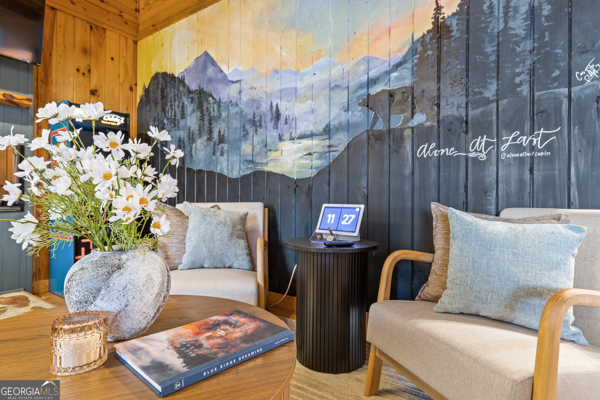 222 Icy Lane Blue Ridge, GA 30513 - Photo 15 of 37 a bed room with a bed a couch and a potted plant