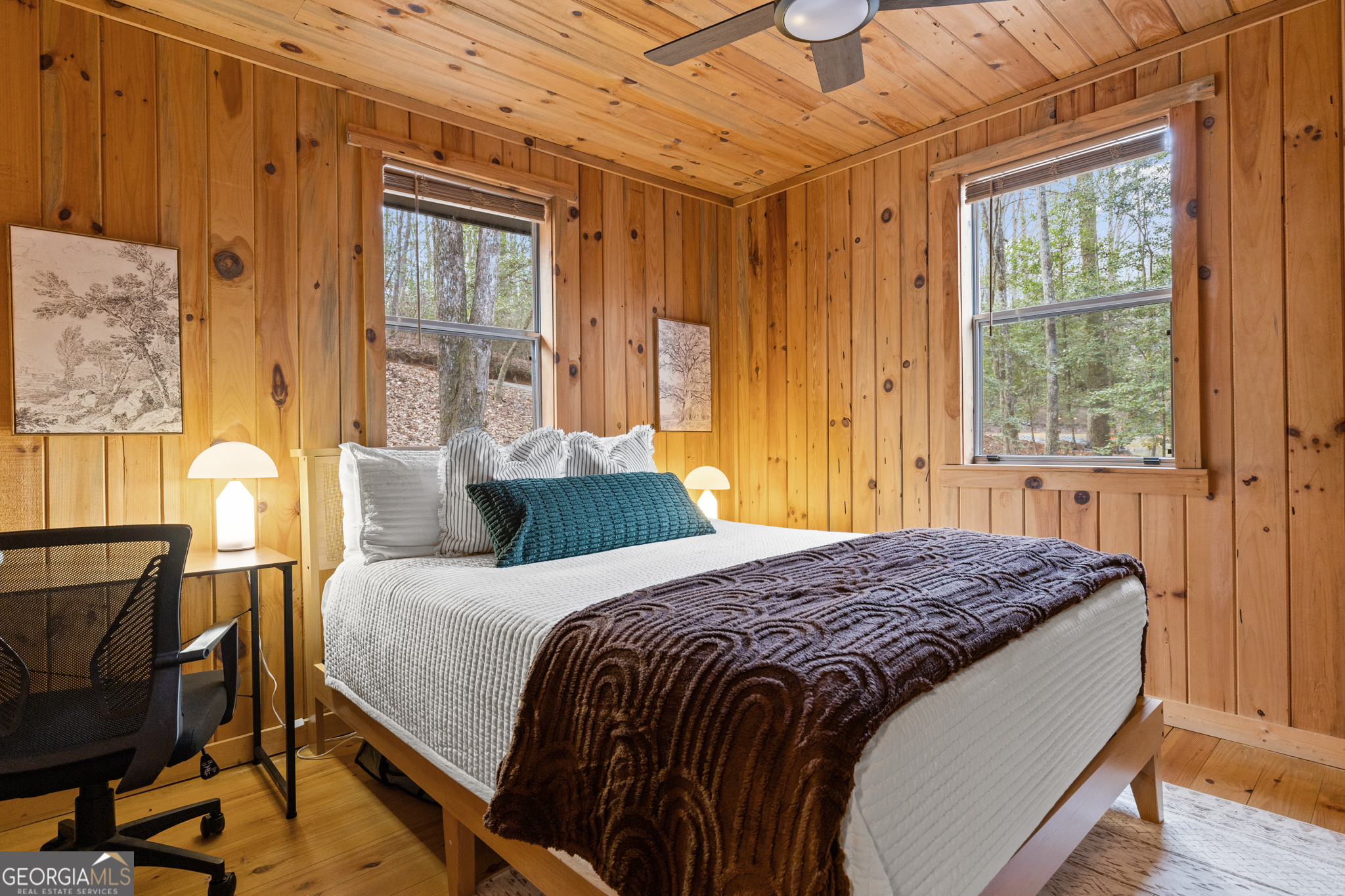 222 Icy Lane Blue Ridge, GA 30513 - Photo 19 of 37 a bedroom with a bed and wooden floor