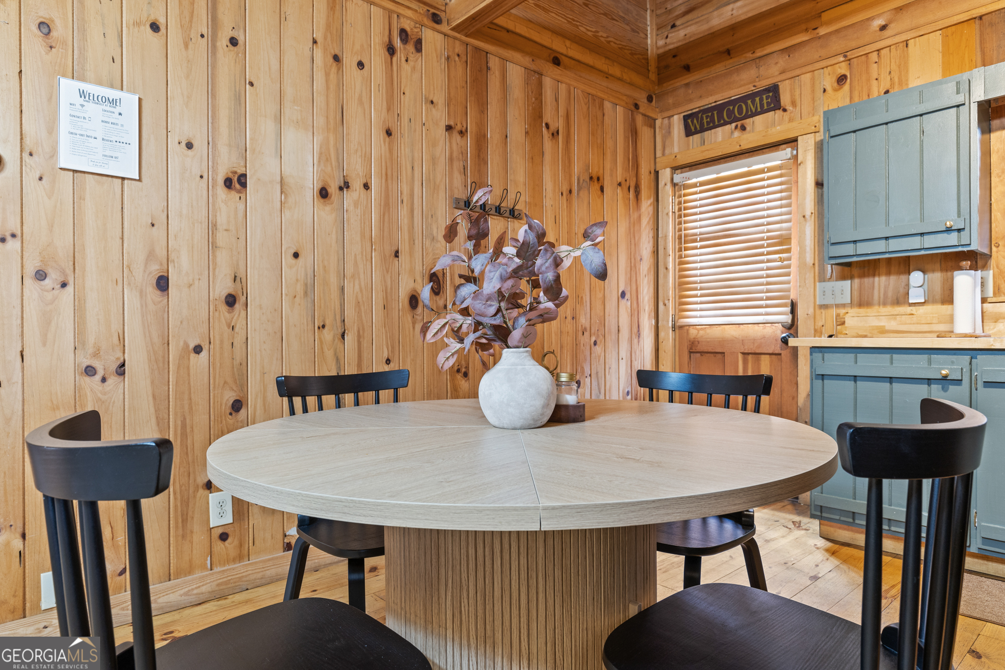 222 Icy Lane Blue Ridge, GA 30513 - Photo 31 of 37 a view of a dining room with furniture and wooden floor