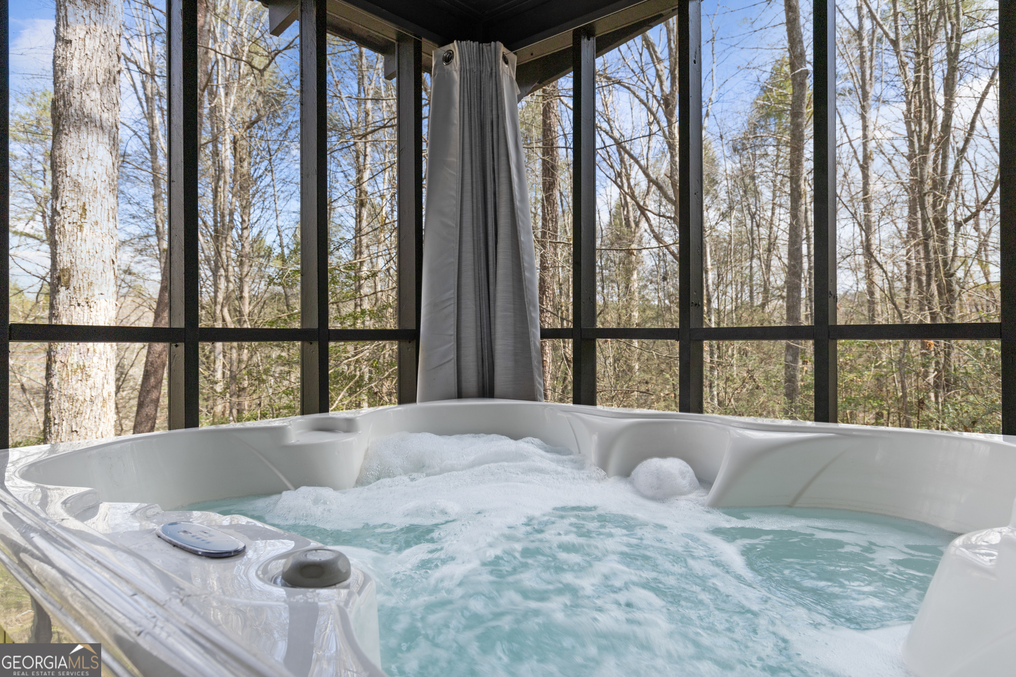 222 Icy Lane Blue Ridge, GA 30513 - Photo 34 of 37 a view of a bedroom with furniture and a large window