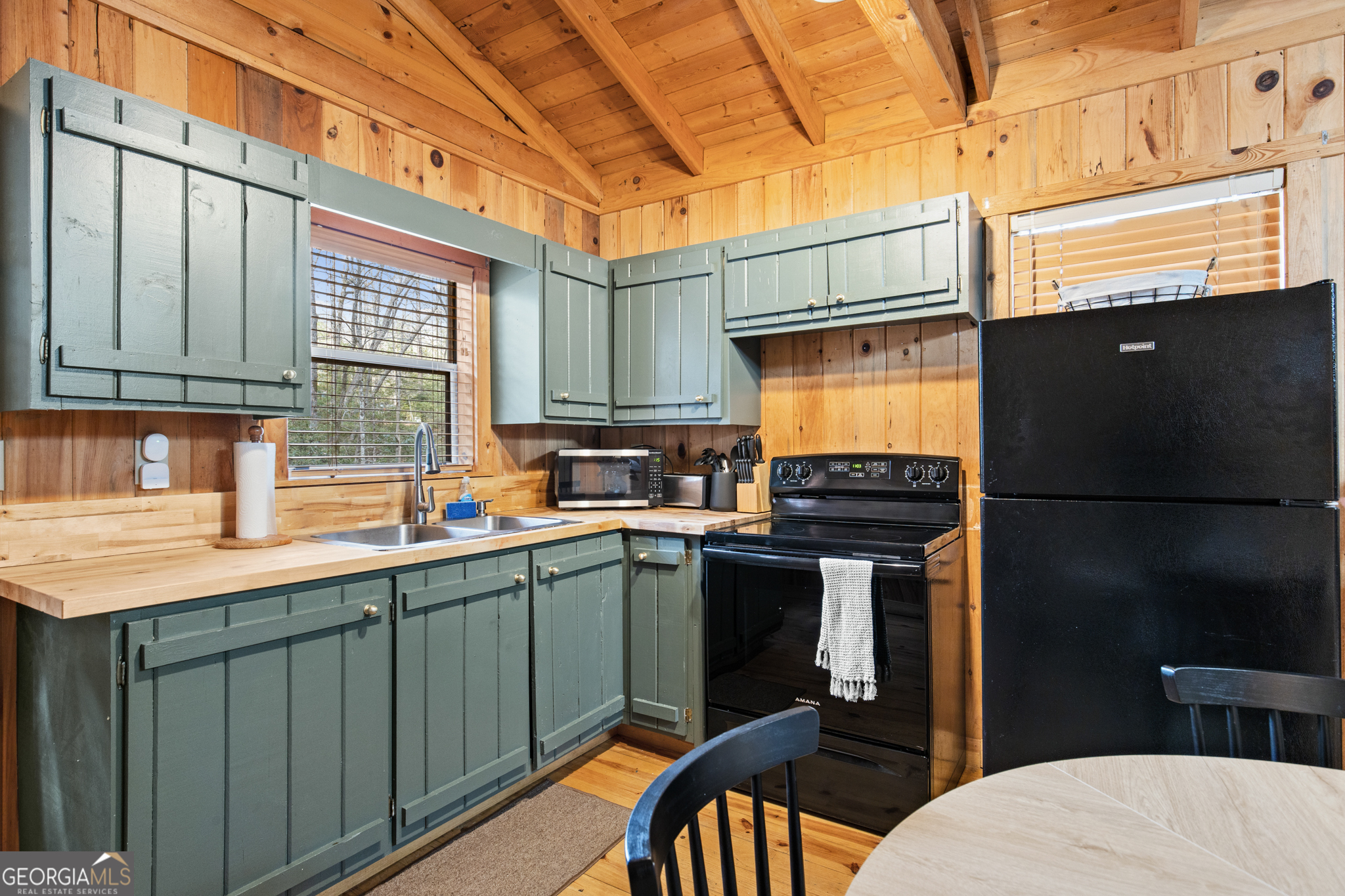 222 Icy Lane Blue Ridge, GA 30513 - Photo 9 of 37 a kitchen with stainless steel appliances a sink cabinets and wooden floor