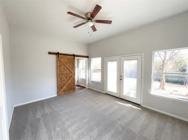 a view of an empty room with a window