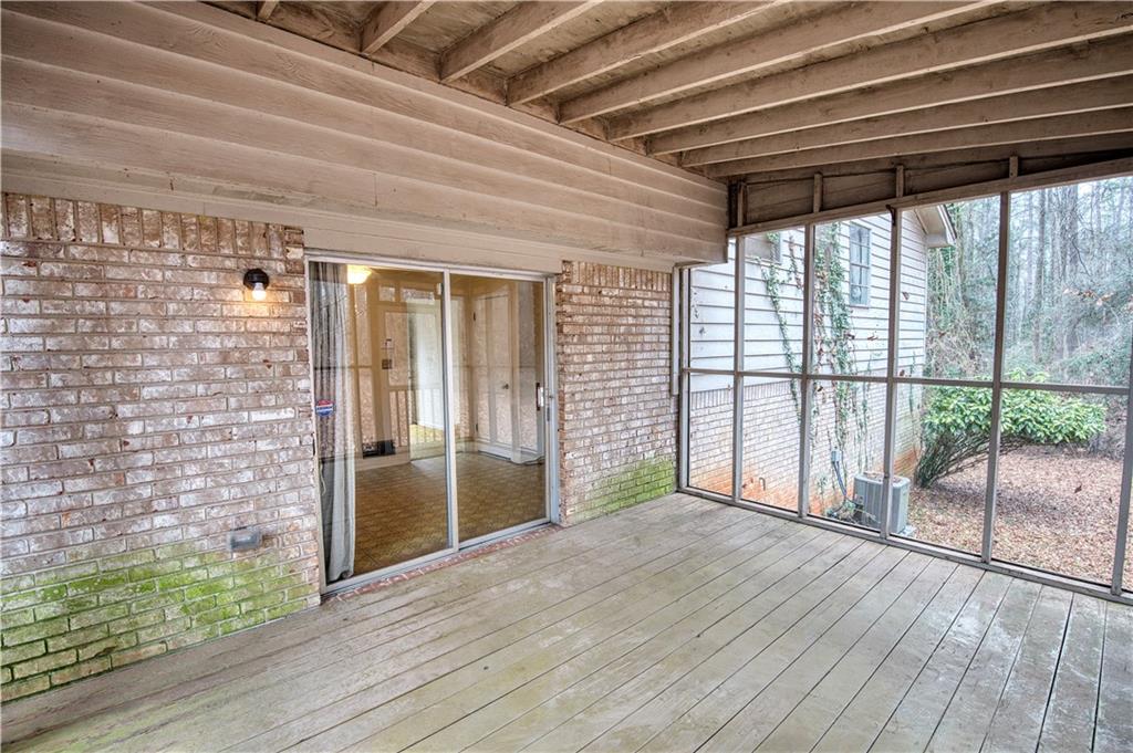 6100 Mincey Road Stone Mountain, GA 30087 - Photo 13 of 40 a view of empty room with wooden floor and fan