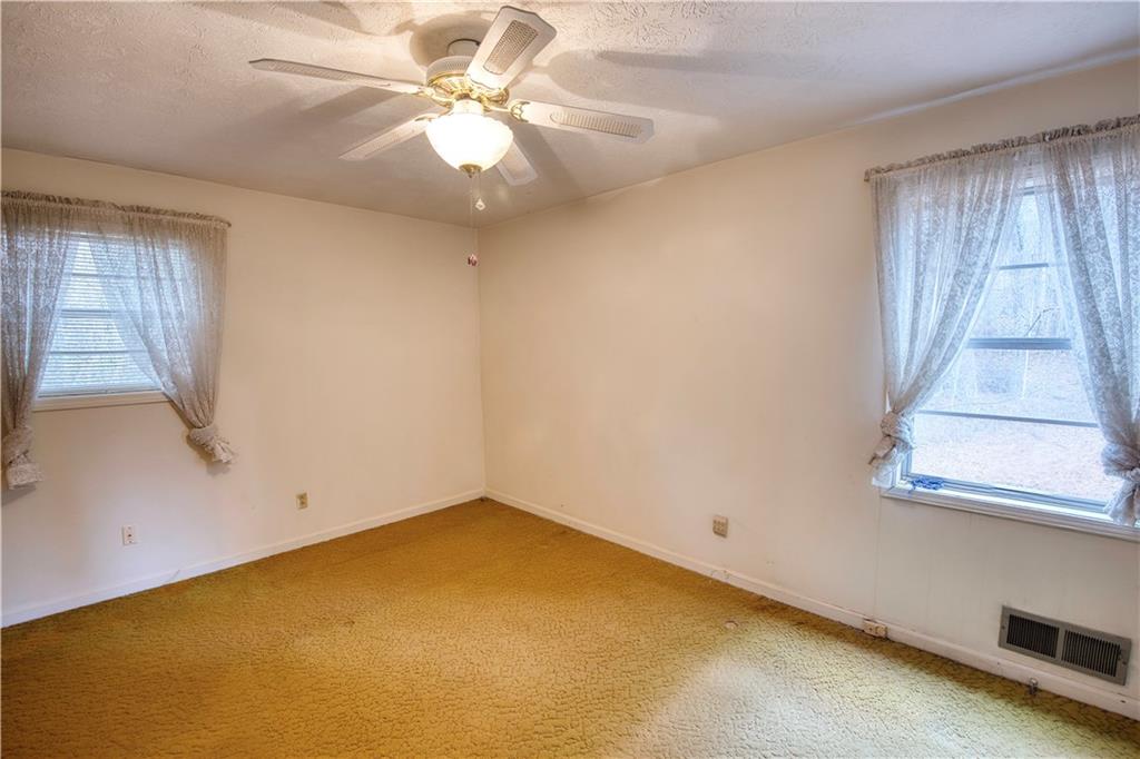 6100 Mincey Road Stone Mountain, GA 30087 - Photo 22 of 40 an empty room with a window