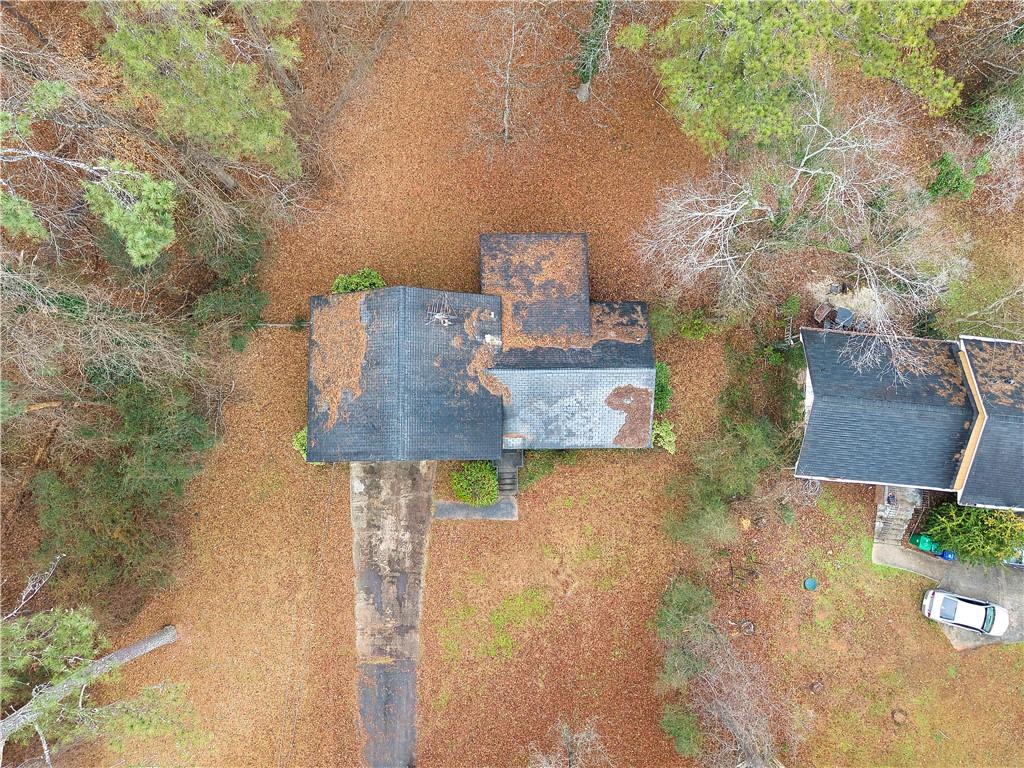 6100 Mincey Road Stone Mountain, GA 30087 - Photo 35 of 40 an aerial view of a house with a yard