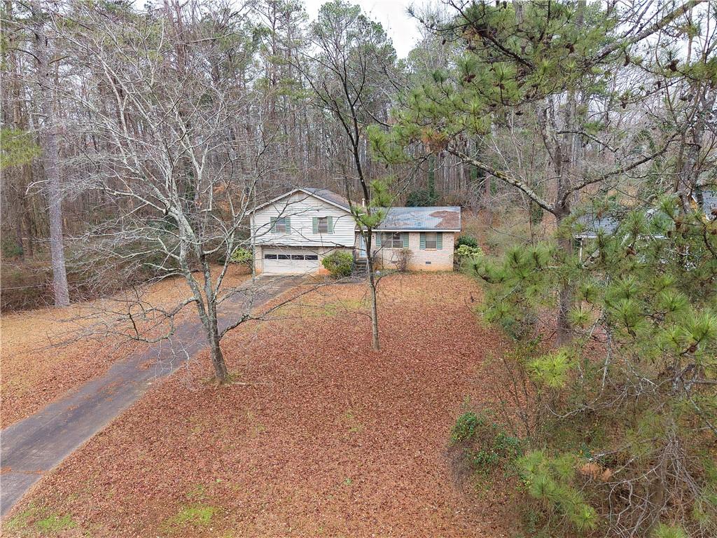 6100 Mincey Road Stone Mountain, GA 30087 - Photo 36 of 40 a view of a park with plants and a bench