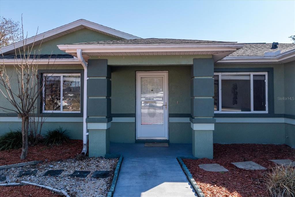 6114 Southwest 104th Street Ocala, FL 34476 - Photo 1 of 28 a front view of a house