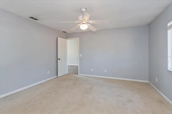 a view of an empty room with a window