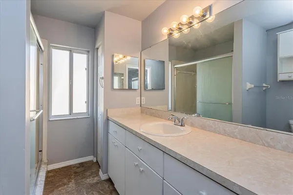 a bathroom with a sink and a mirror