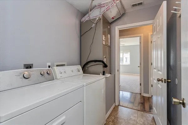 a utility room with dryer and washer