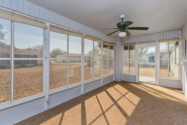 a view of an empty room with a large window