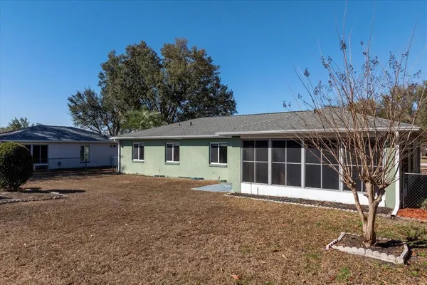 a house with trees in the background