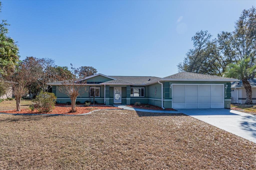 6114 Southwest 104th Street Ocala, FL 34476 - Photo 3 of 28 a view of a house with a yard