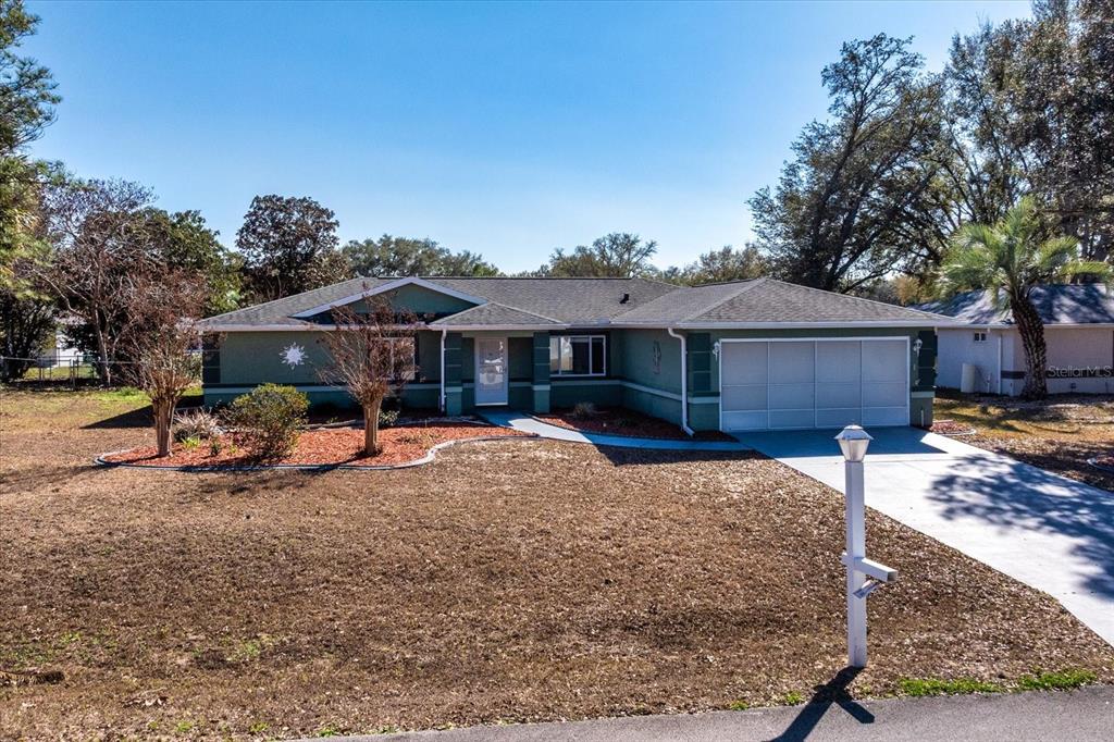 6114 Southwest 104th Street Ocala, FL 34476 - Photo 4 of 28 a view of a house with a patio