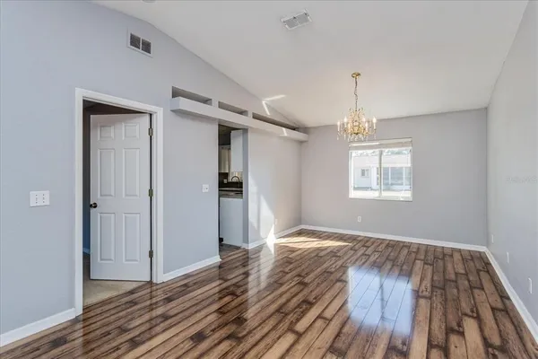 a view of livingroom with hardwood floor and hallway
