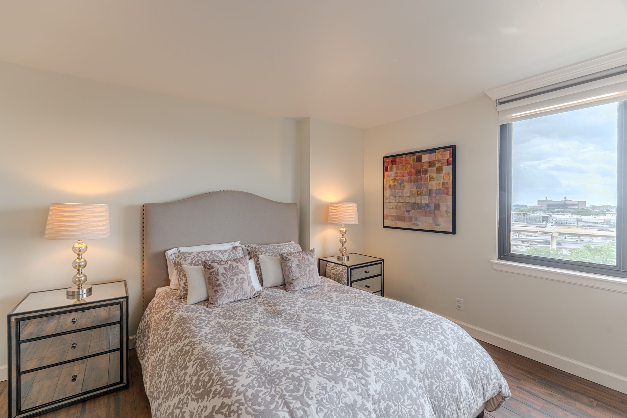 3525 Sage Road, Unit 1016 Houston, TX 77056 - Photo 33 of 42 a bedroom with a bed and a night stand