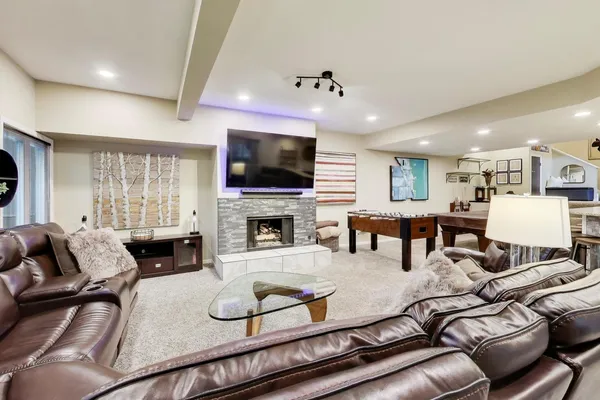 a living room with furniture fireplace and a flat screen tv
