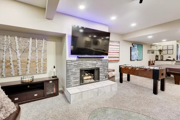 a living room with furniture and a fireplace