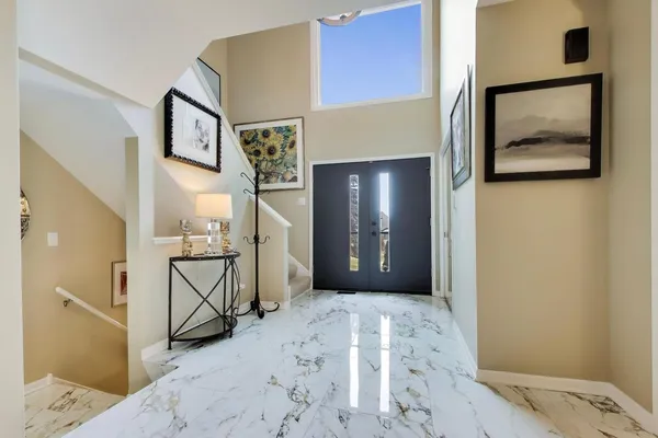 a view of a hallway with paintings on the wall