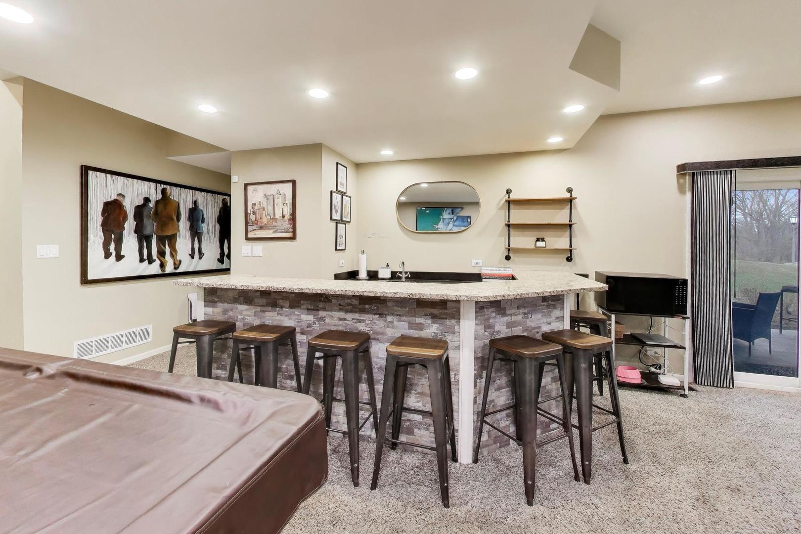 22 Rodeo Drive Burr Ridge, IL 60527 - Photo 31 of 46 a living room with stainless steel appliances kitchen island granite countertop furniture and a view of kitchen