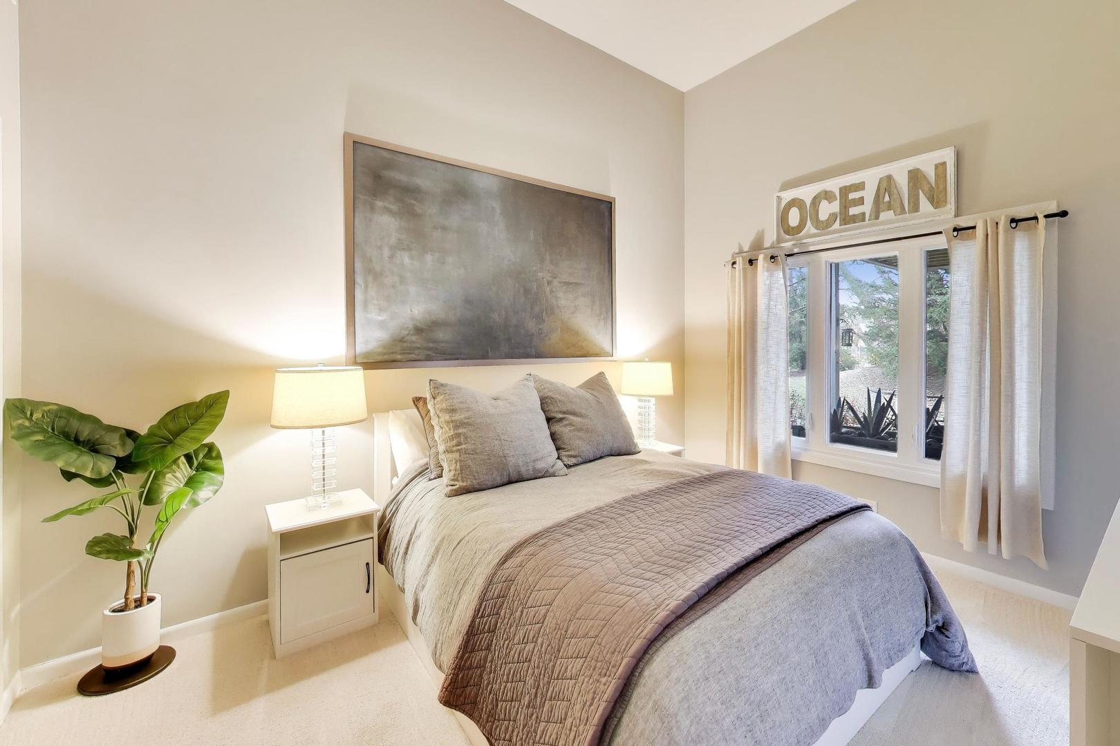 22 Rodeo Drive Burr Ridge, IL 60527 - Photo 32 of 46 a bedroom with a large bed and a potted plant